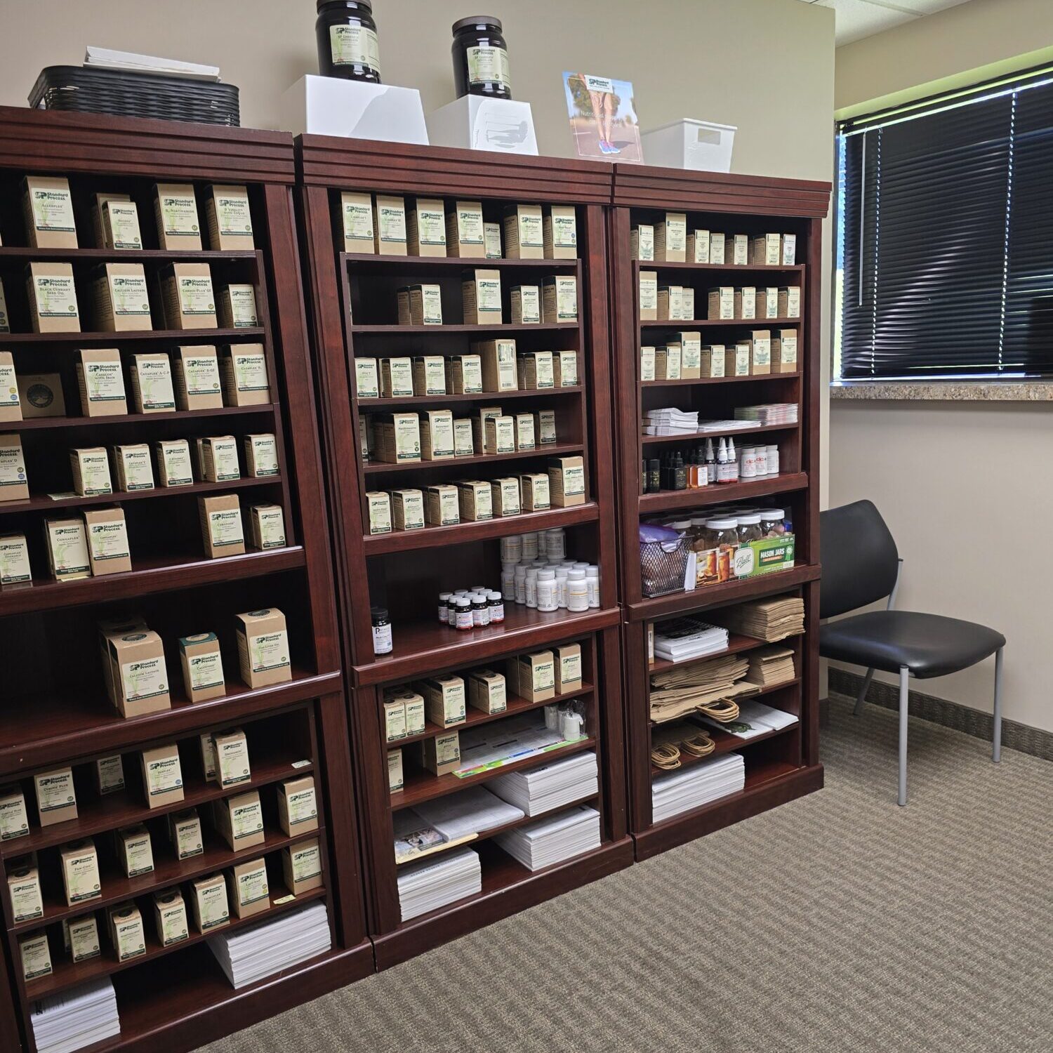 standard process supplements Shelves filled with herbal tea and supplements.
